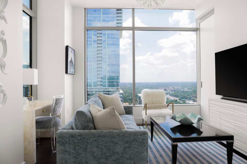 home office lounge with coffee table and blue and white striped area rug